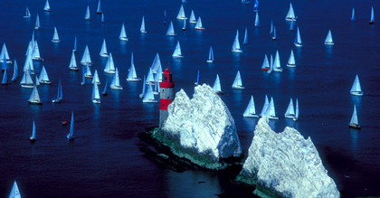 The Needles lighthouse and flotilla of sailing boats, Isle of Wight © www.britainonview.com